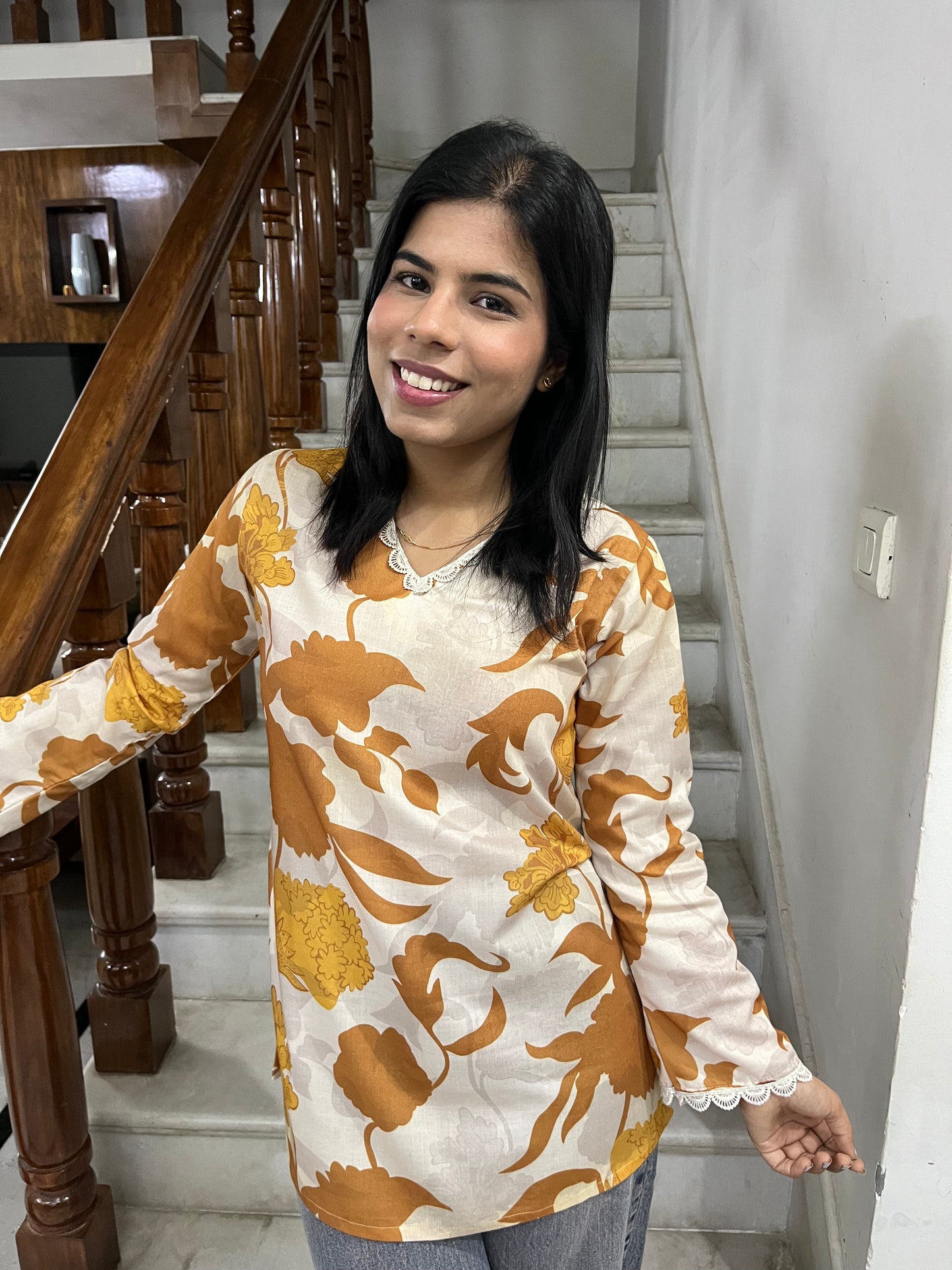 Yellow printed kurti top with lace work