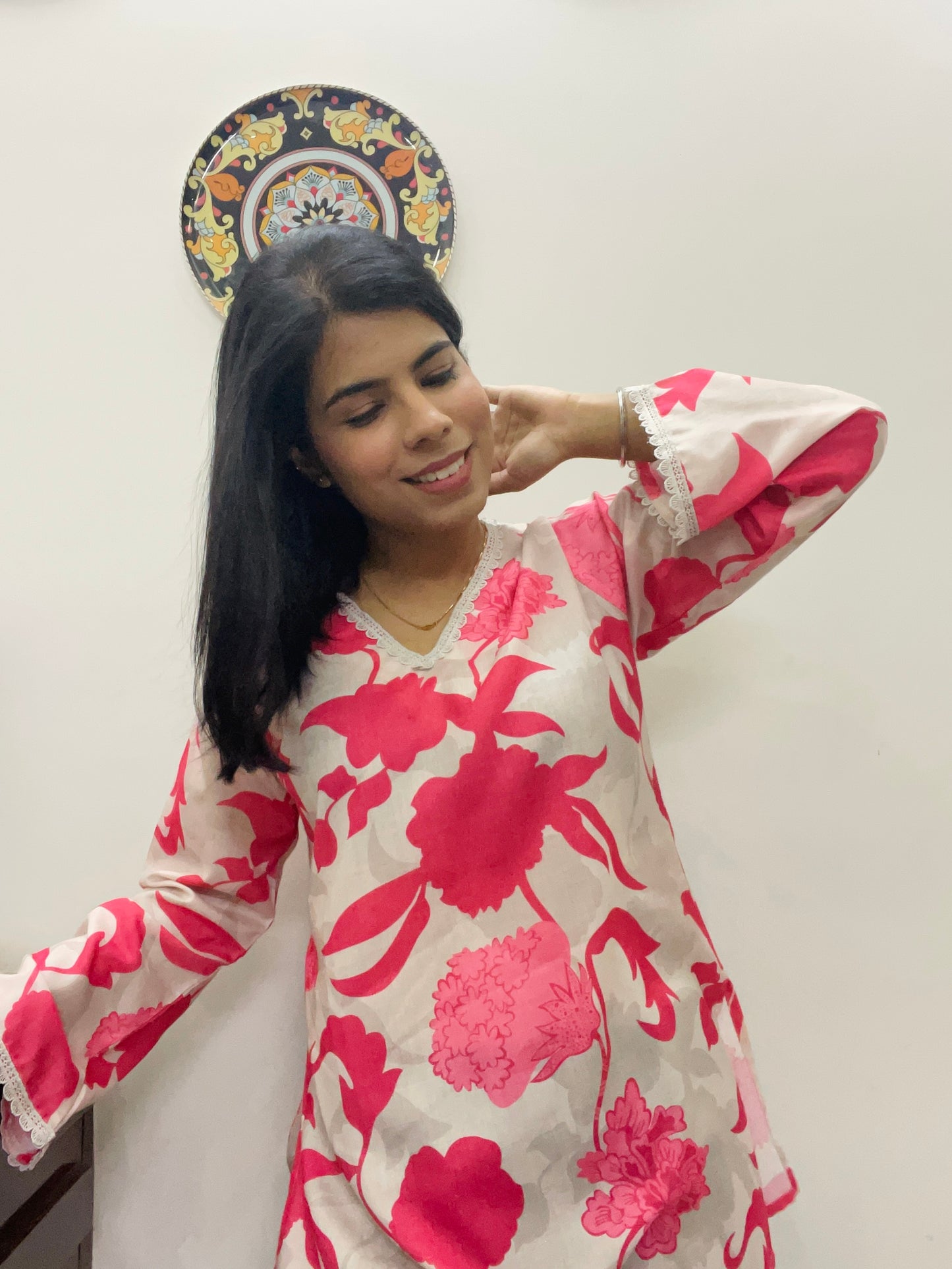 Pink printed kurti top with lace work